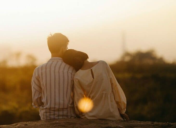 married couple watching sunset